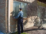 police officer checking windows