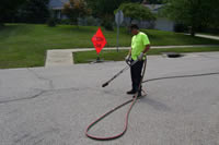 man fixing pavement